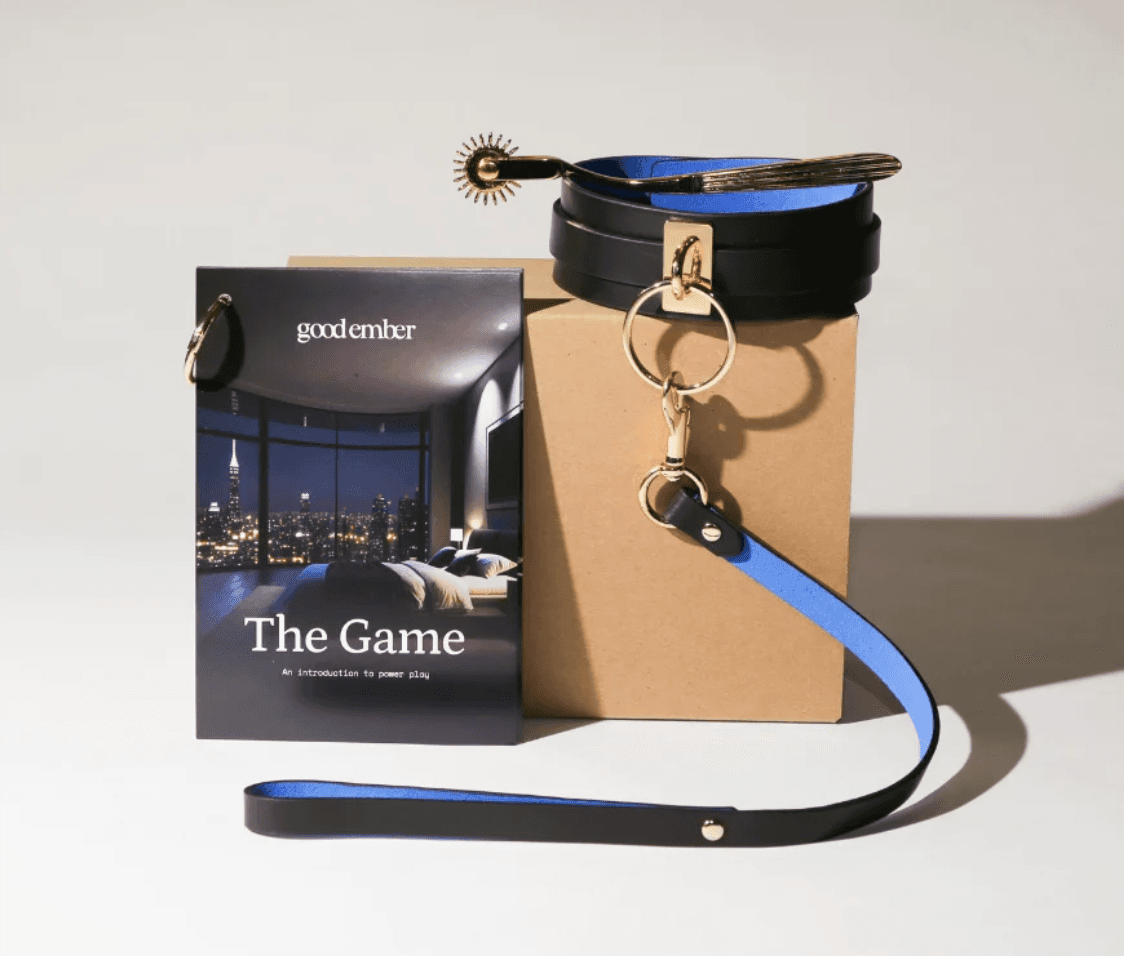 The Good Ember Box open, with its leather gear, toys and guidance cards laid out.
